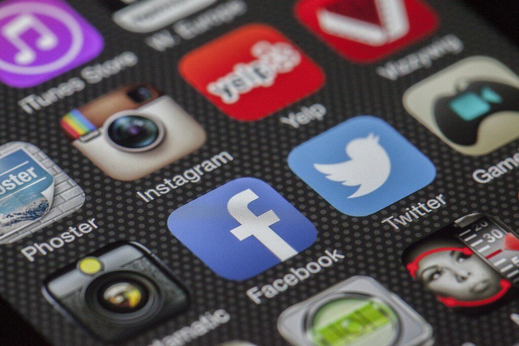 person holding smartphone copying link social app