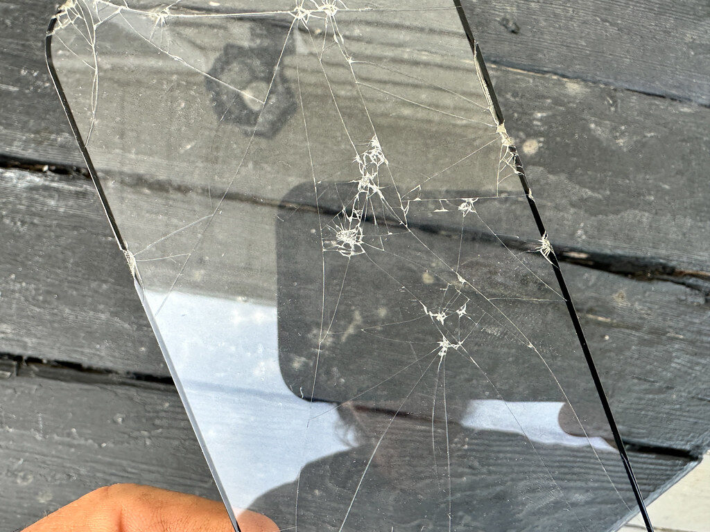 hand saving photo on phone screen