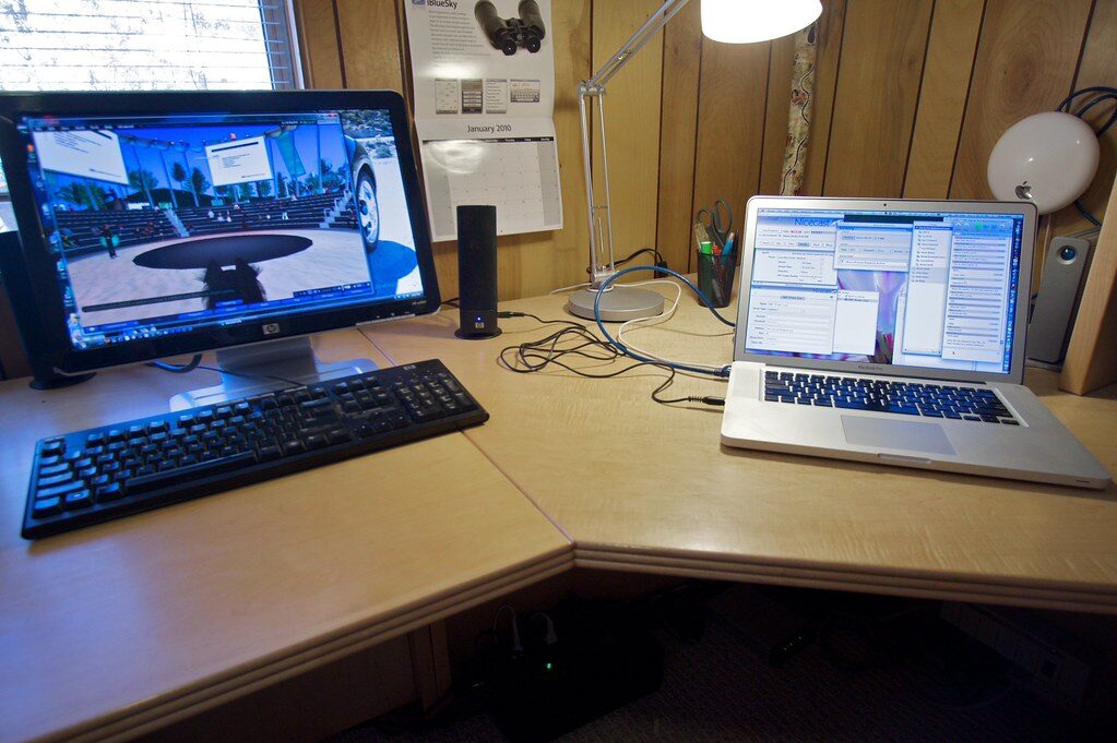 headphones on desk with laptop